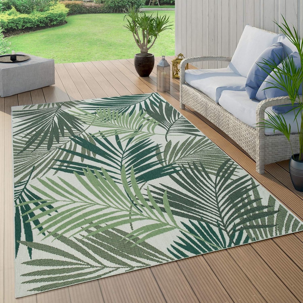 weerbestendig buitenkleed met tropisch palmbladpatroon voor balkon en terras