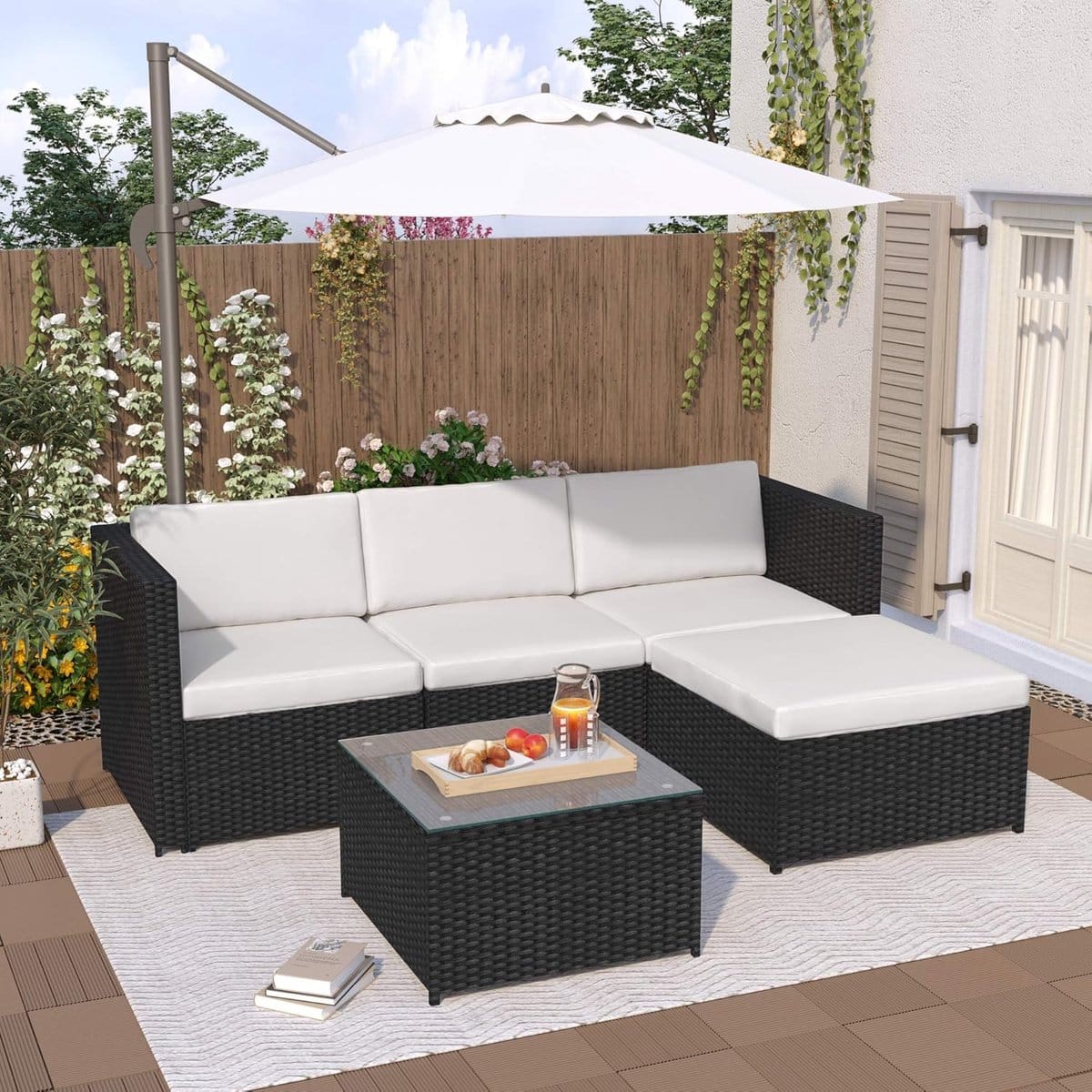 luxe polyrattan hoek loungeset met glazen tafel en kussens