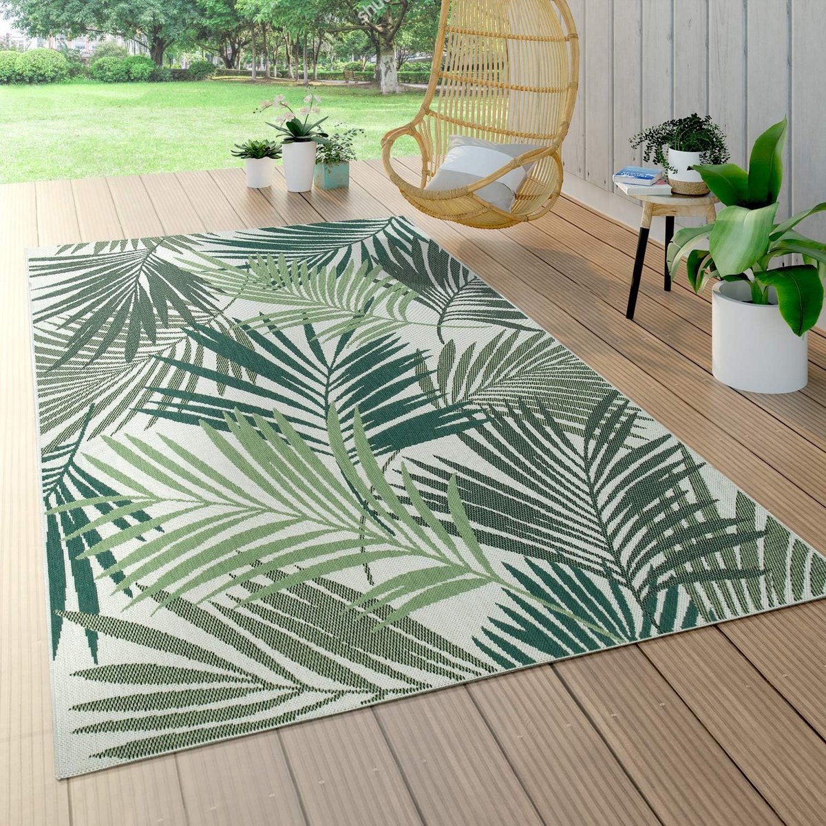 ronde buitenmat met palmblad & bloemenprint weerbestendig vloerkleed tuin
