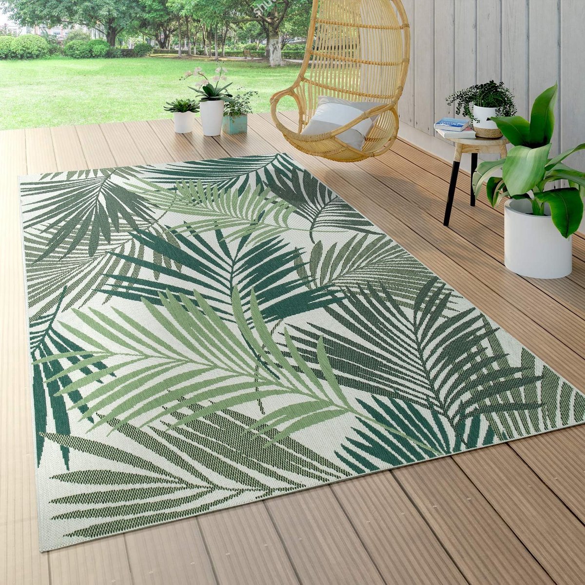 weerbestendig buitenkleed met tropisch palm en bloemenpatroon groen