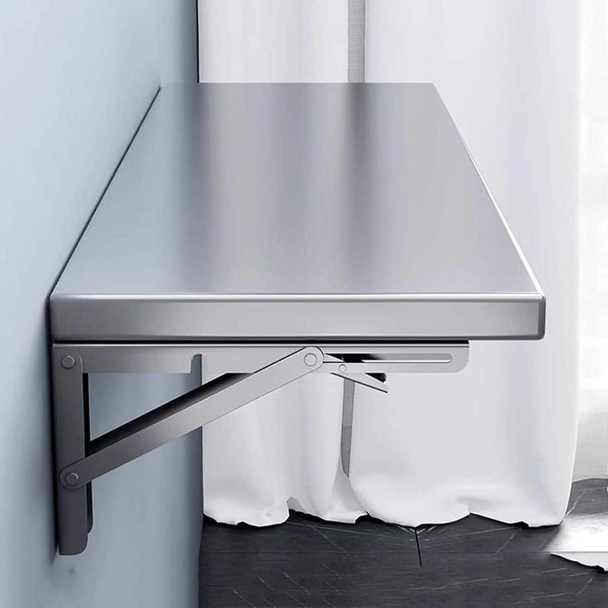 opvouwbare wandtafel klaptafel aan muur ruimte besparen